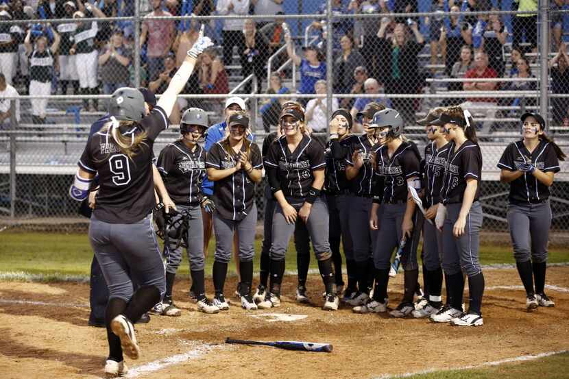 North Forney's Marilyn Rizzato (9) celebrates as she comes home to celebrate with teammates...