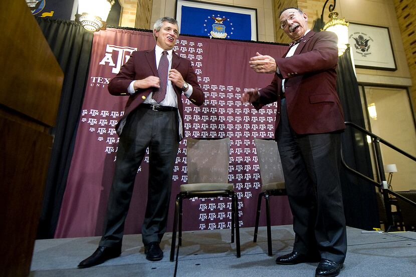 Texas A&M University president R. Bowen Loftin, right, welcomes Eric Hyman as the school's...