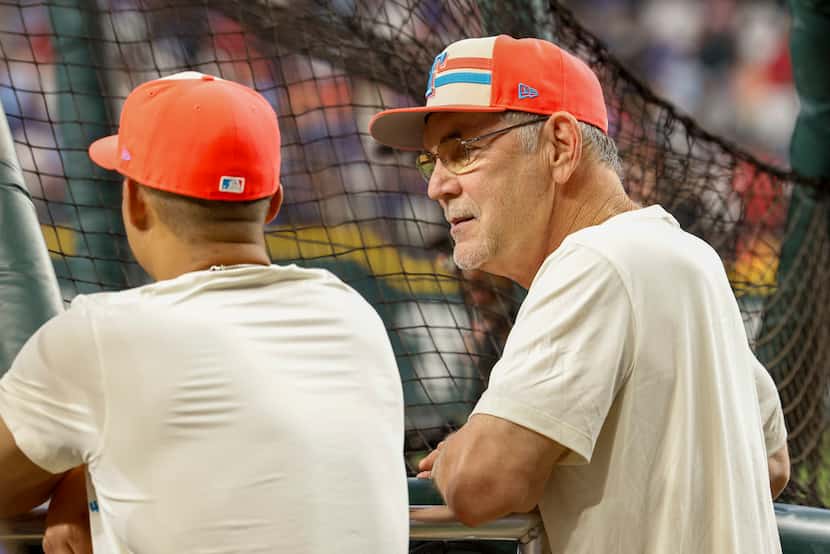 American League manager Bruce Bochy, of the Texas Rangers, talks at the batting cage before...