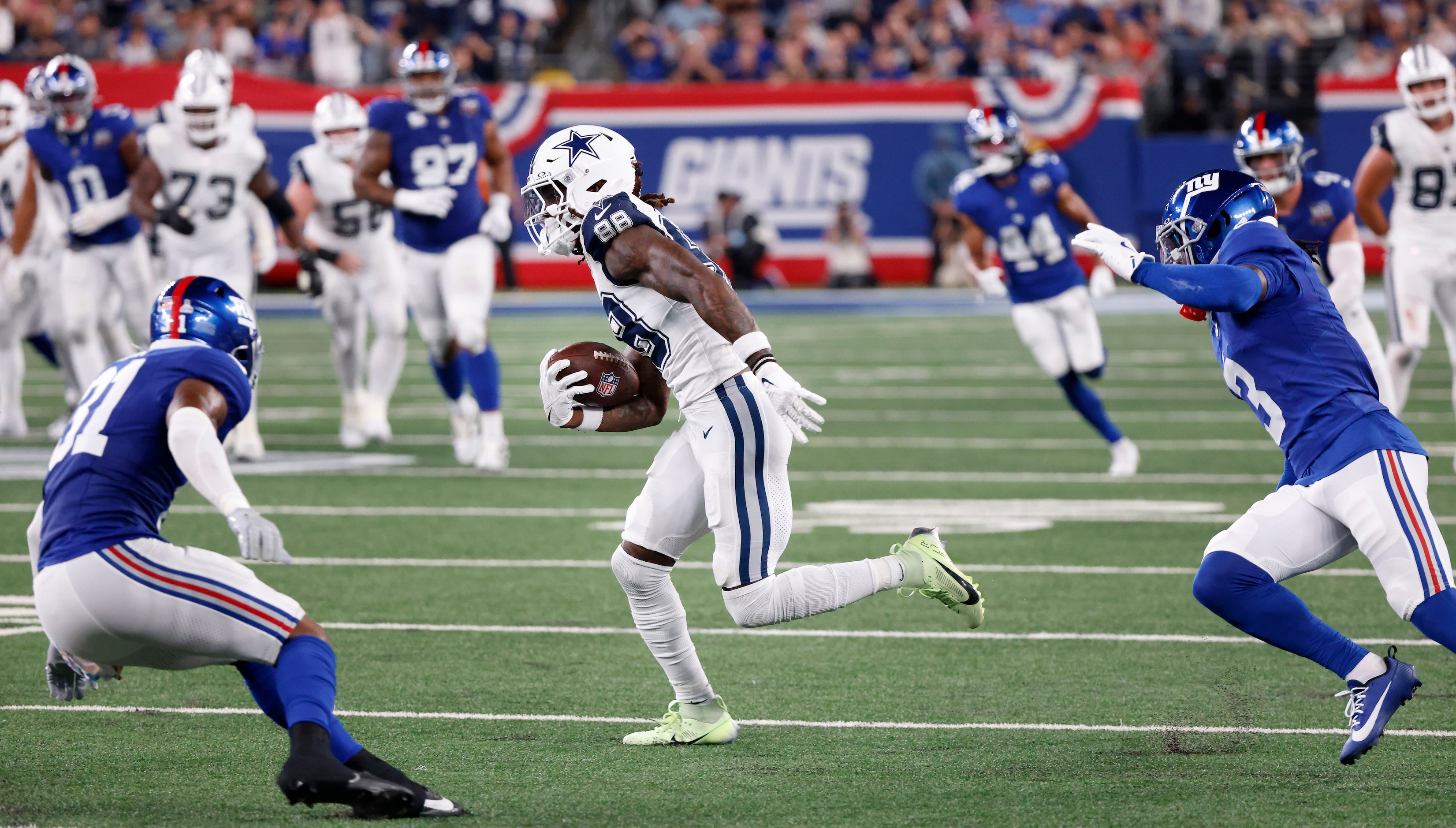 Dallas Cowboys wide receiver CeeDee Lamb (88) catches a pass in front of New York Giants...