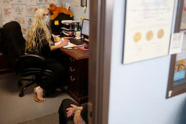 Sheila Baker, LCDC (licensed chemical dependency counselor) talks with a patient at the...