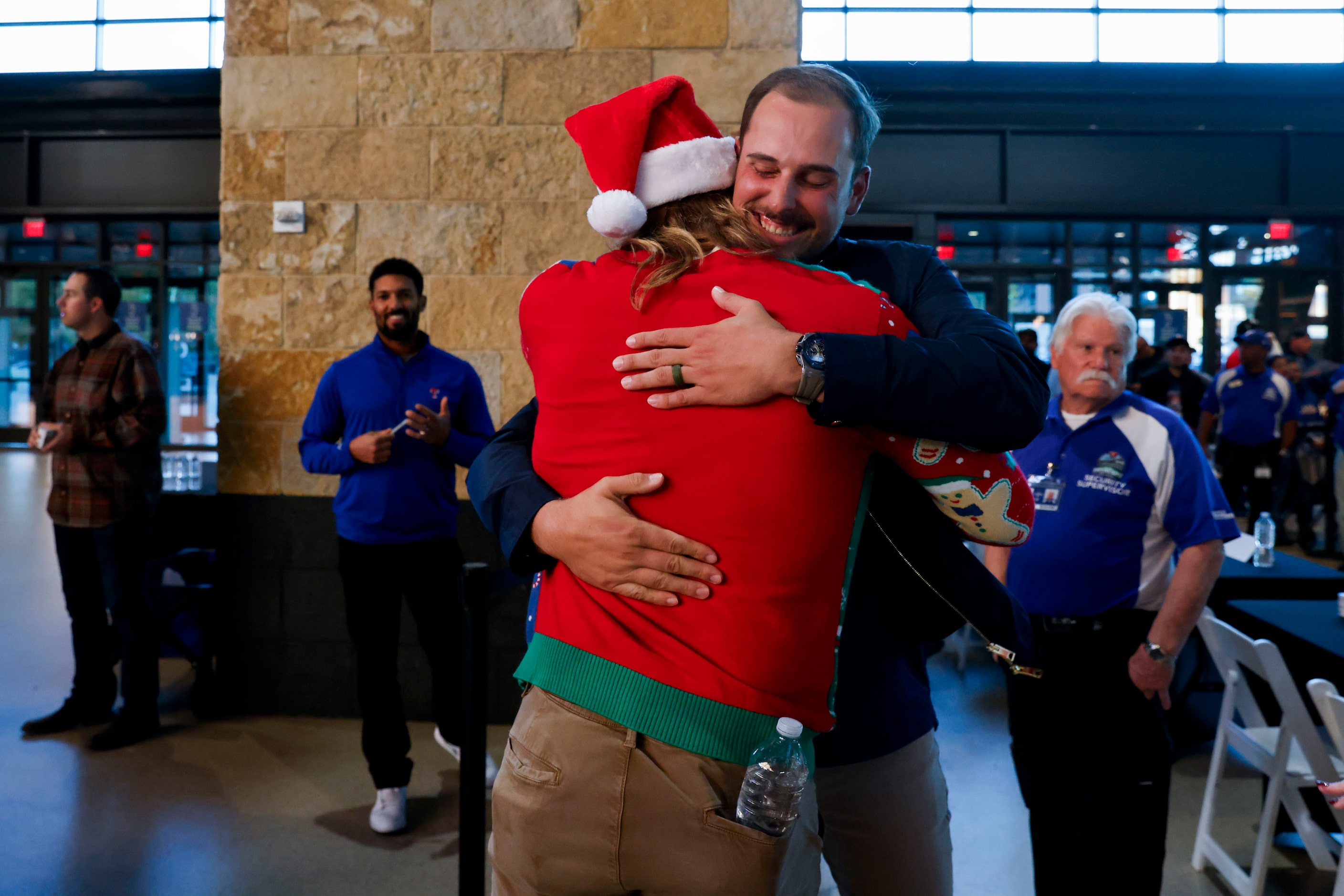 Texas Rangers pitcher Jon Gray (front) embraces first baseman Nathaniel Lowe as he arrives...