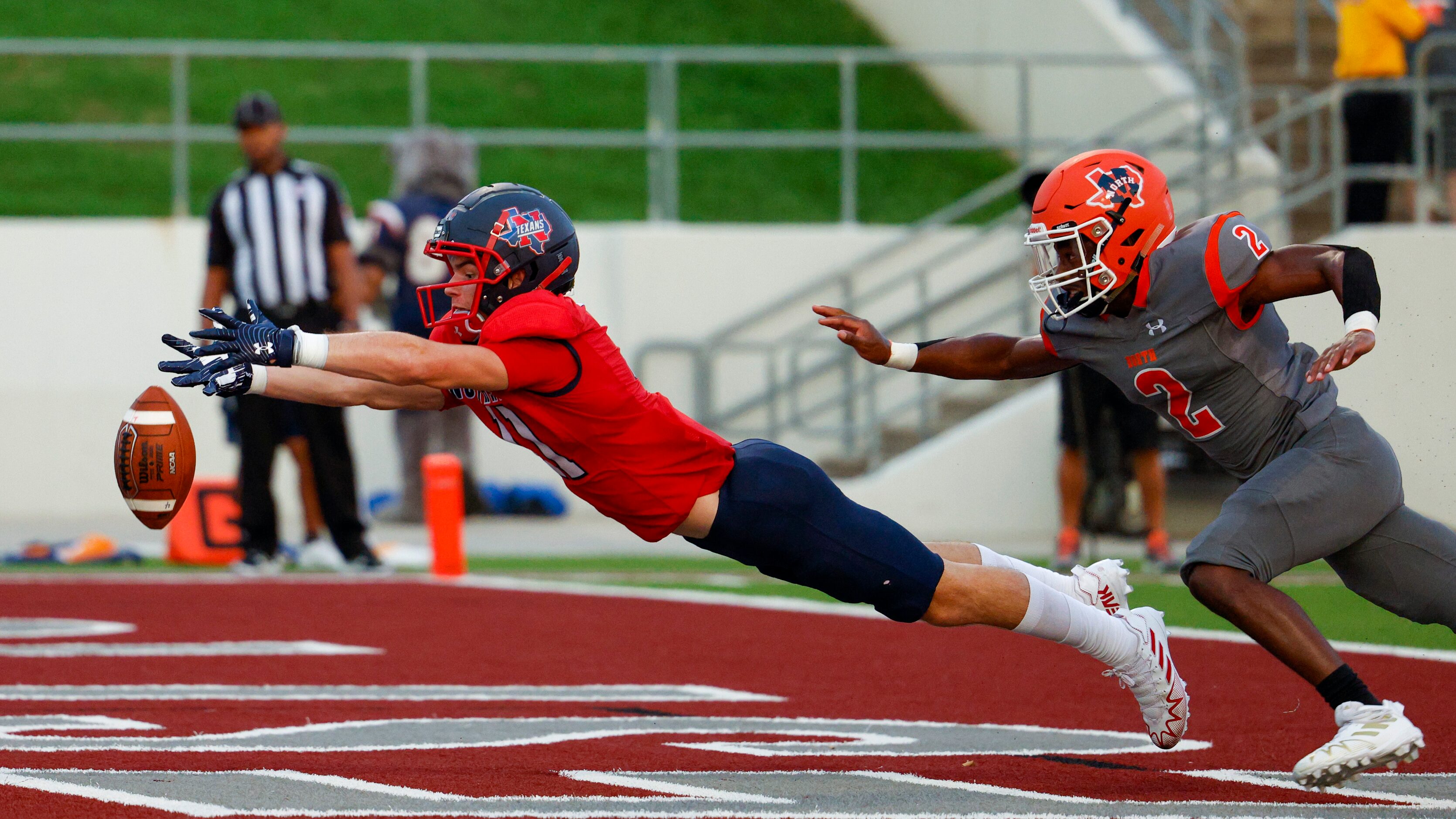 Justin Northwest wide receiver Kenan Reil (11) dives trying to make a catch ahead of...