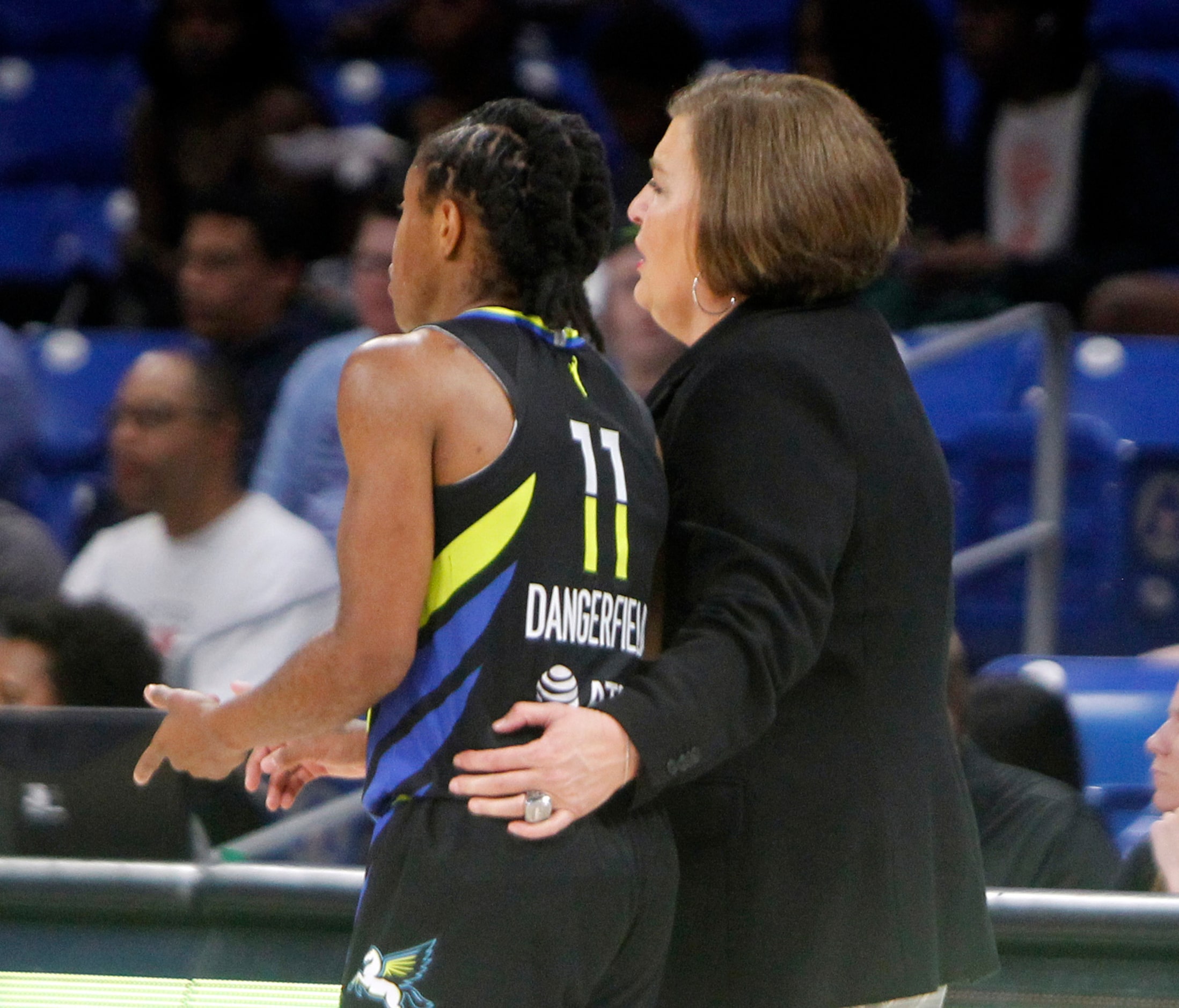 Dallas Wings head coach Latricia Trammell shares some game strategy with Dallas Wings guard...