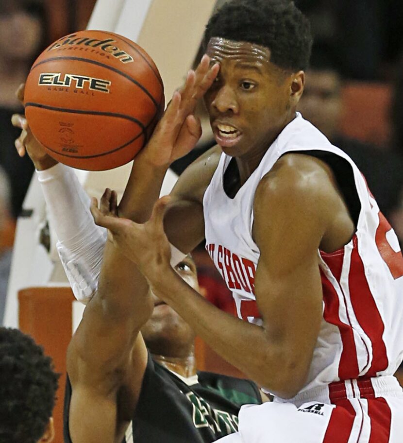 Desoto guard Leon Sneed (3) takes a swipe at the ball and Galena Park North Shore's Kerwin...