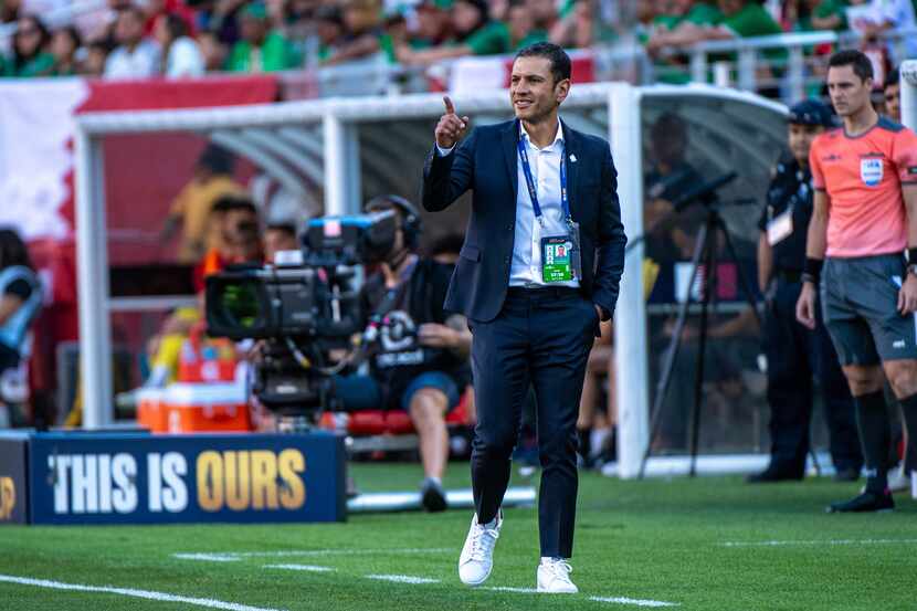 Jaime Lozano watches players during a game between Qatar and Mexico during the Concacaf Gold...