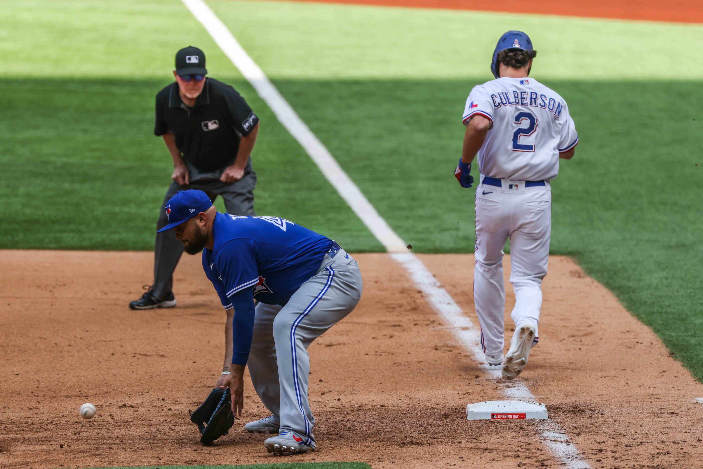 Texas Rangers' infielder Charlie Culberson No. 2 reaches first base safe during opening day...