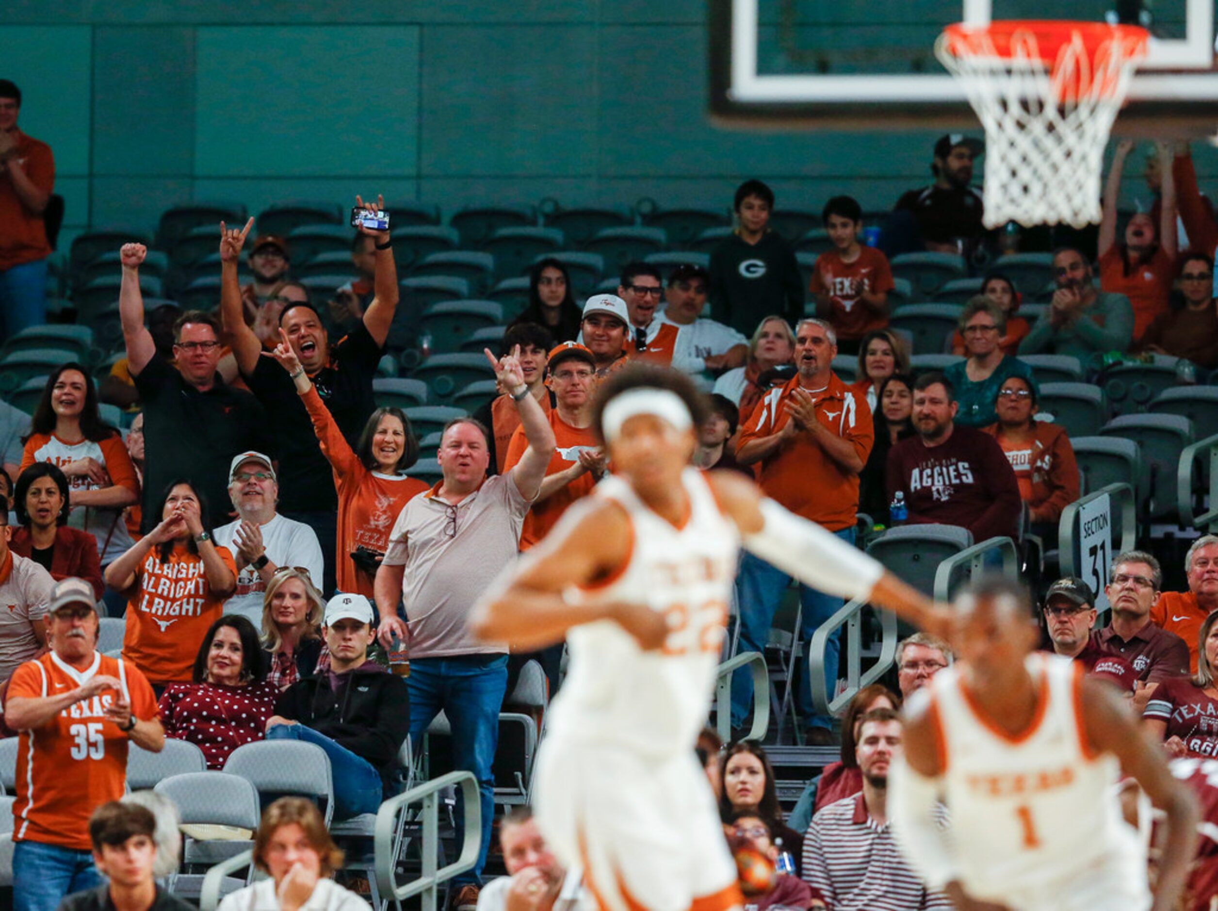 Texas fans celebrate a dunk by Texas Longhorns guard Andrew Jones (1)  during the second...