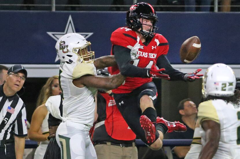 Texas Tech Red Raiders wide receiver Dylan Cantrell (14) makes a great effort but can't haul...