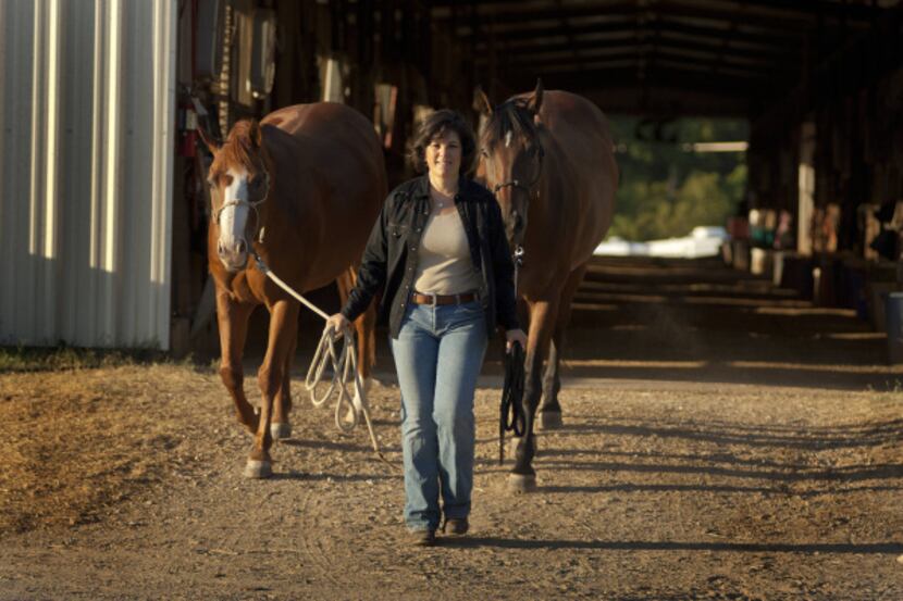 Melinda Folse, author of "The Smart Woman's Guide to Midlife Horses," leads  Rio (left) and...