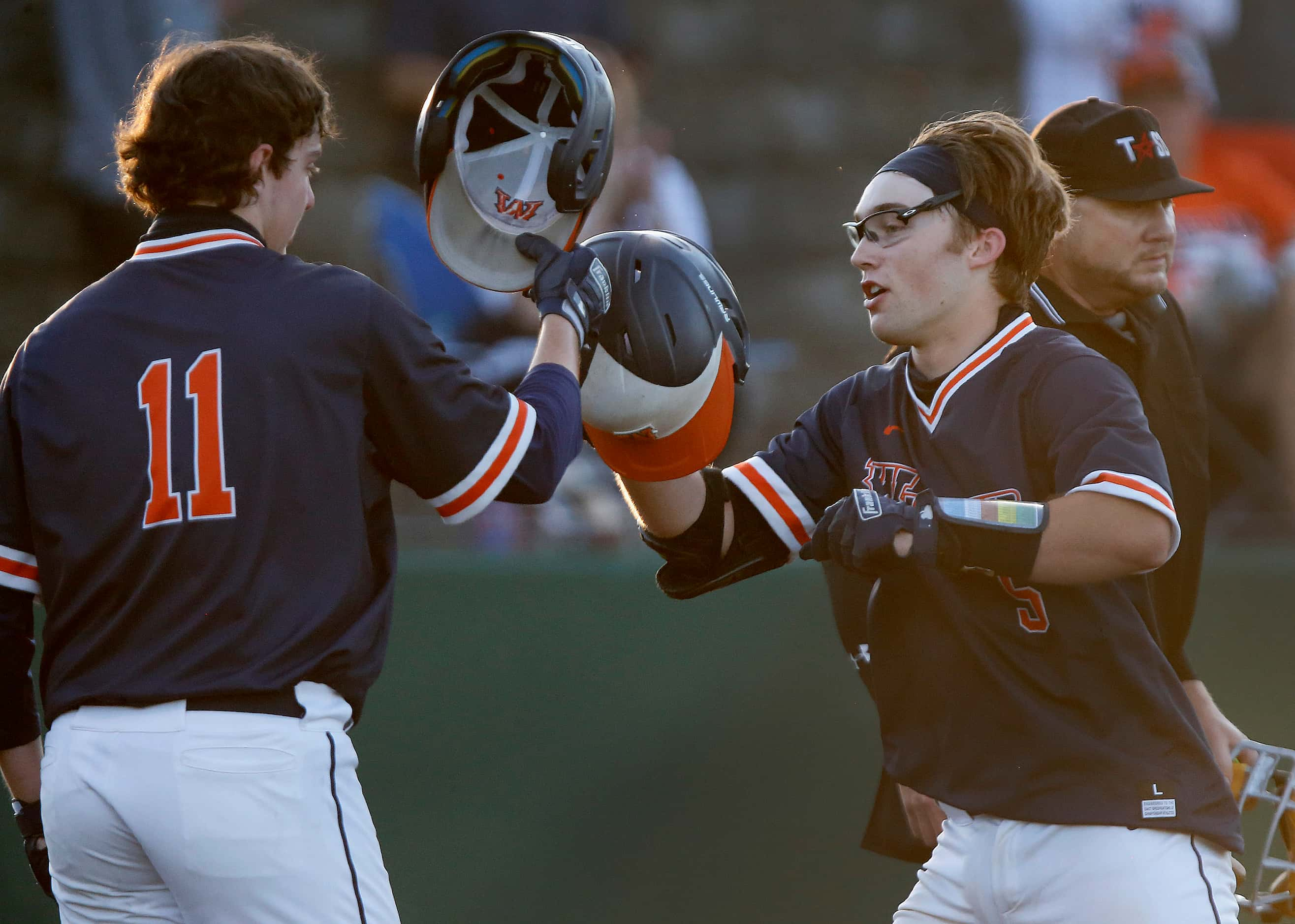 Wakeland High School first baseman Preston Snead (11) congratulates Wakeland High School...