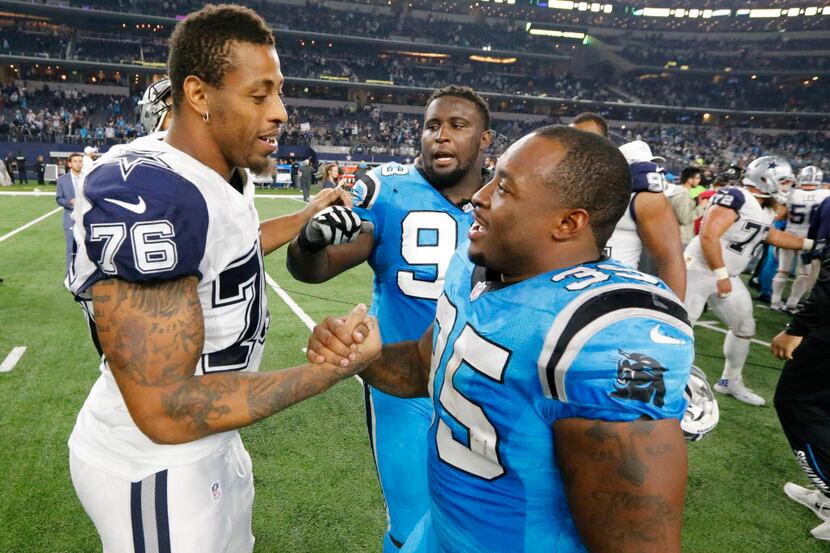 Dallas Cowboys defensive end Greg Hardy (76) is greeted by former teammates Carolina...