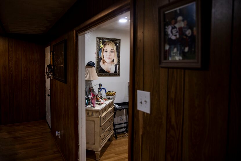 A photograph of Blanca Leon hangs above an altar commemorating family members who died from...