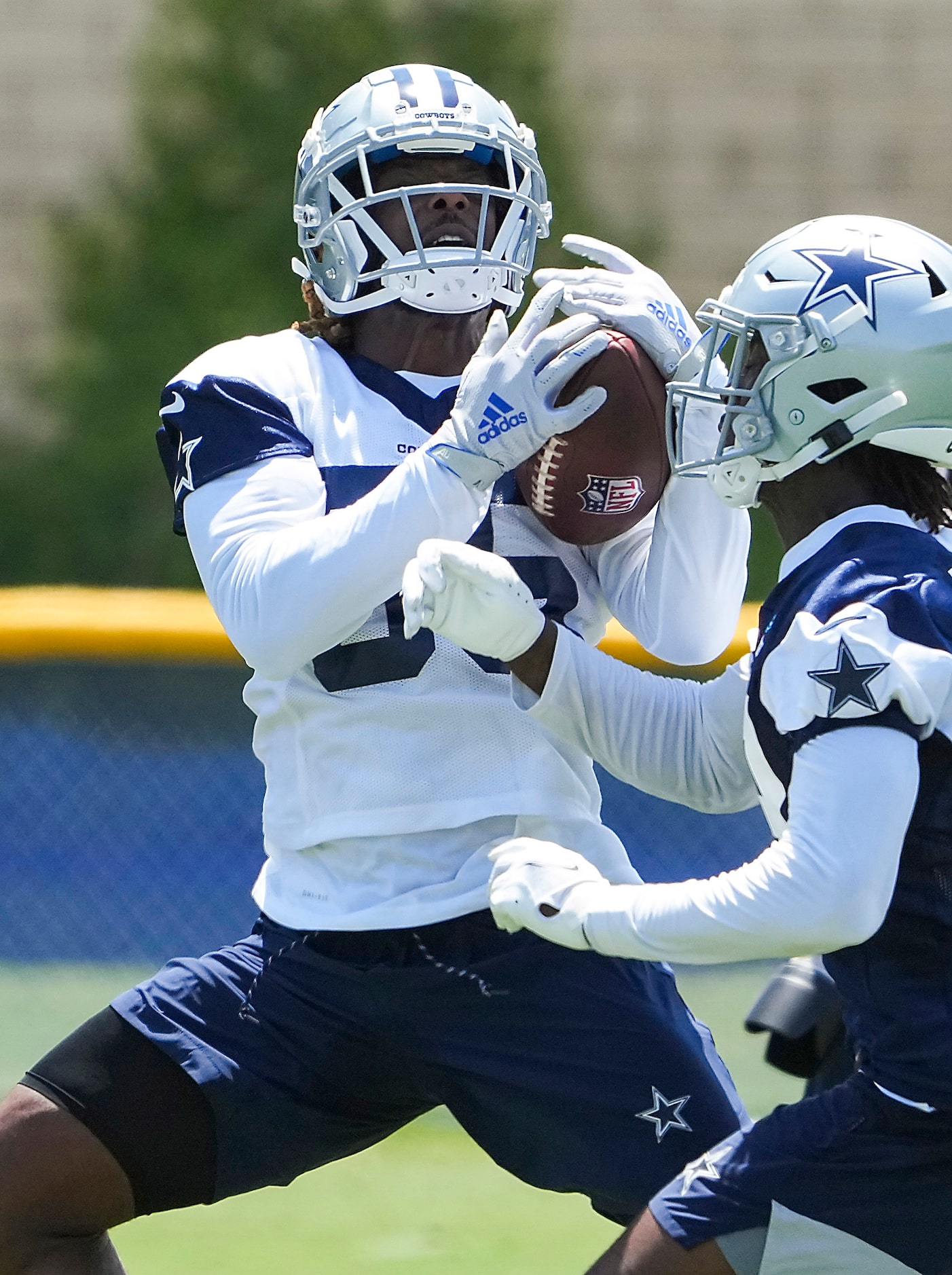 Dallas Cowboys wide receiver Noah Brown (85) makes a catch as cornerback Deante Burton (33)...