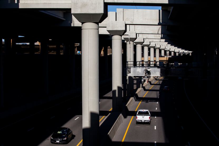 Vehicles make their way through Interstate 635 Express toll road near Valley View Lane on...