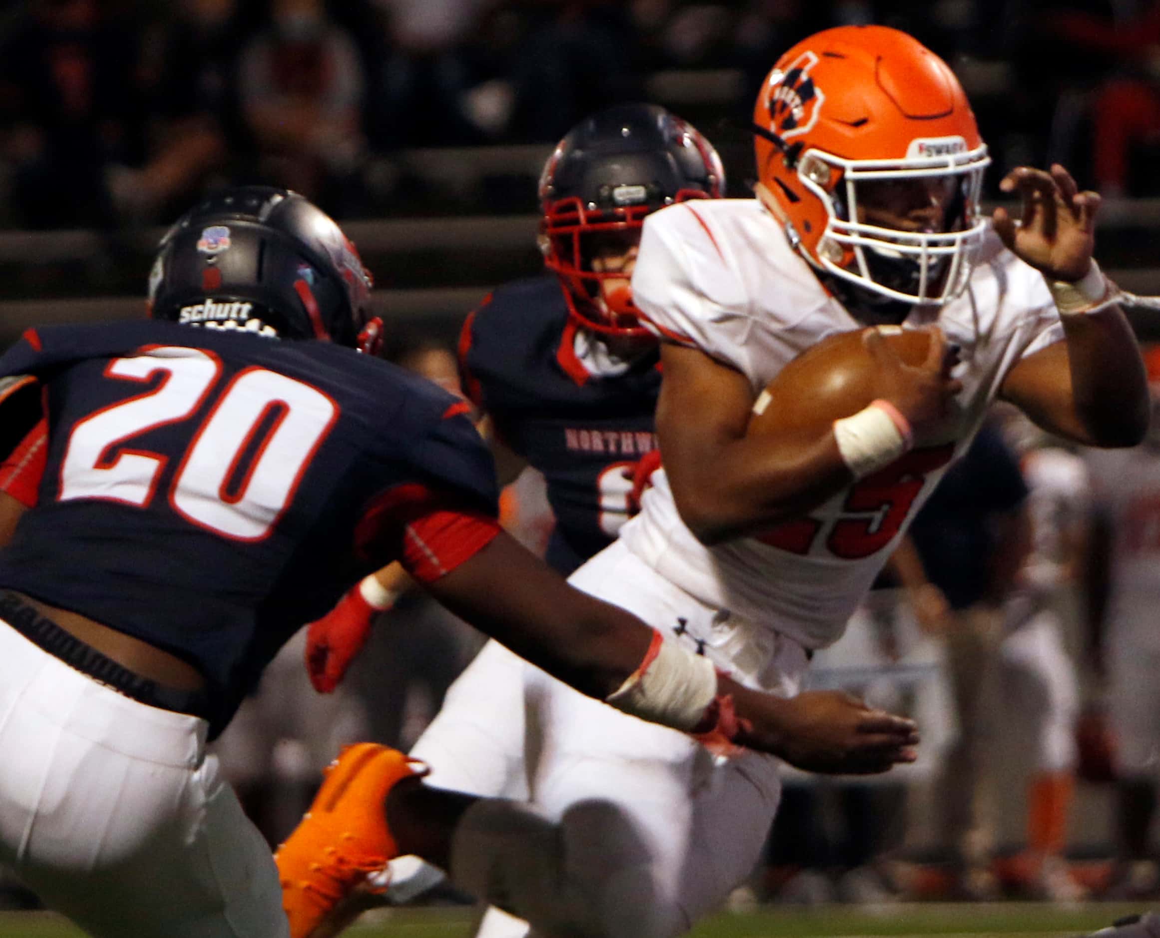 McKinney North running back Jayden Smith (25) drives for a couple of tough yards near the...