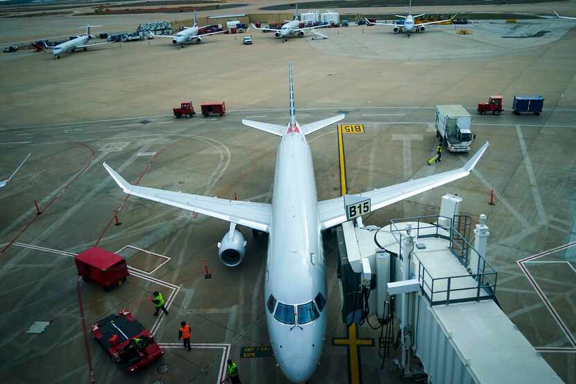 American Eagle planes parked at their gates at DFW International Airport.