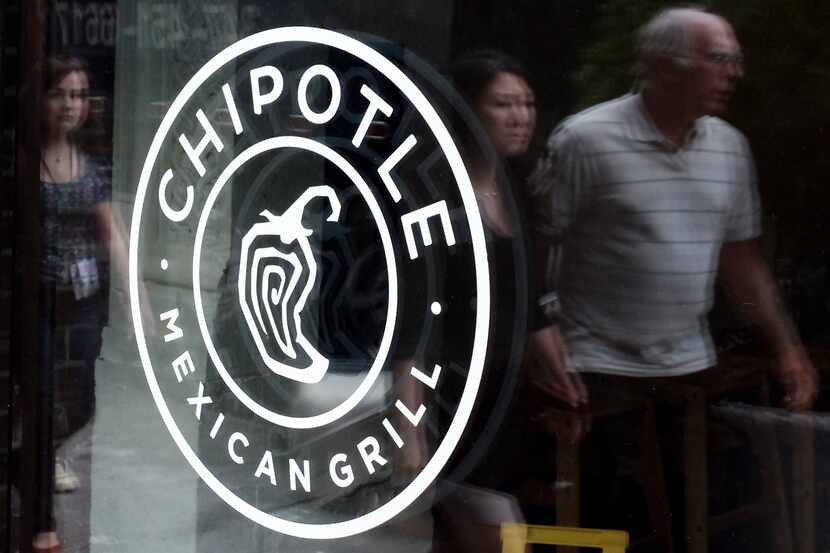 (FILES) This September 9, 2015 file photo shows a Chipotle restaurant sign in New York. ...