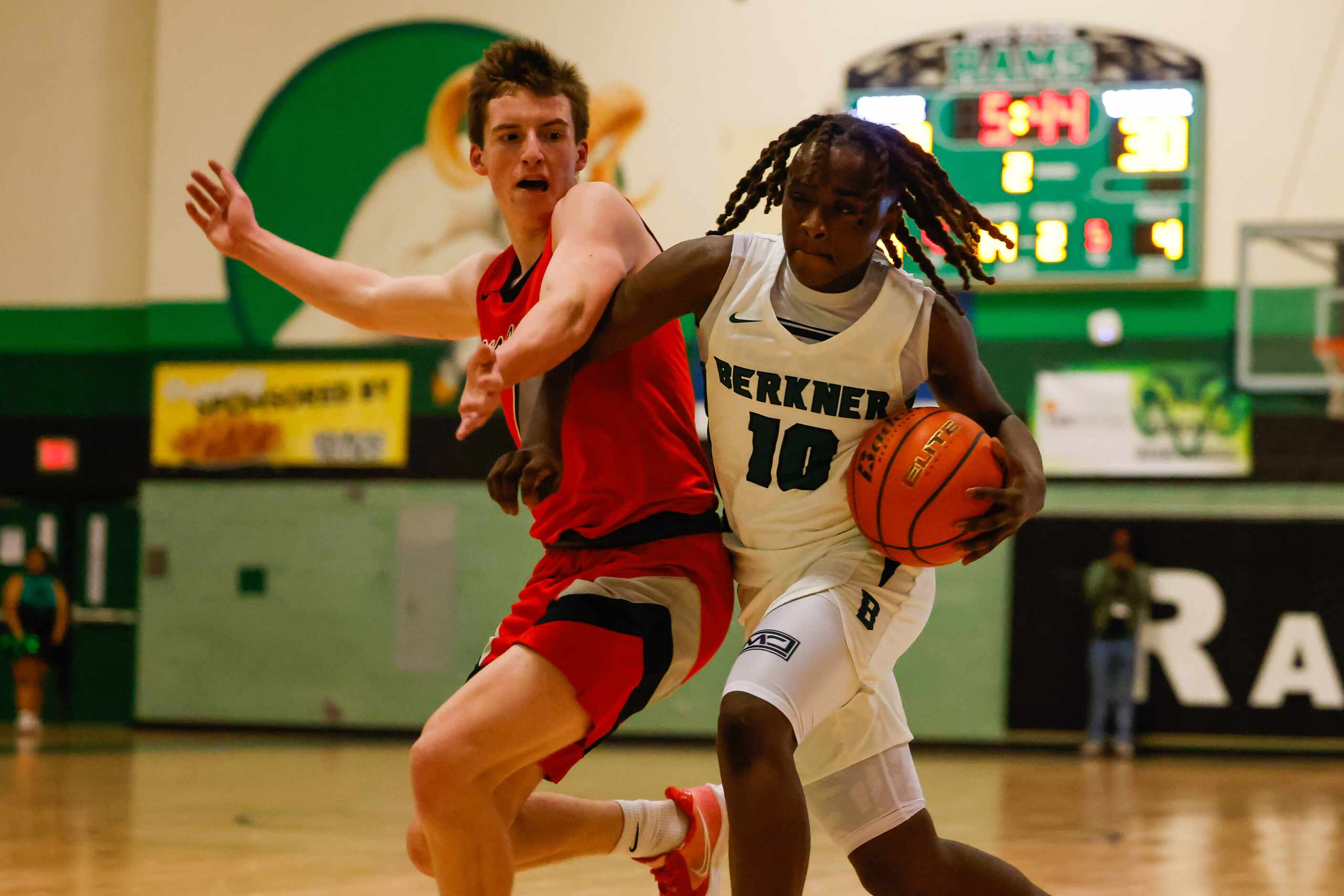 Berkner High School' Demarcus Calhoun #10 goes around Lake Highlands High School' Warren...