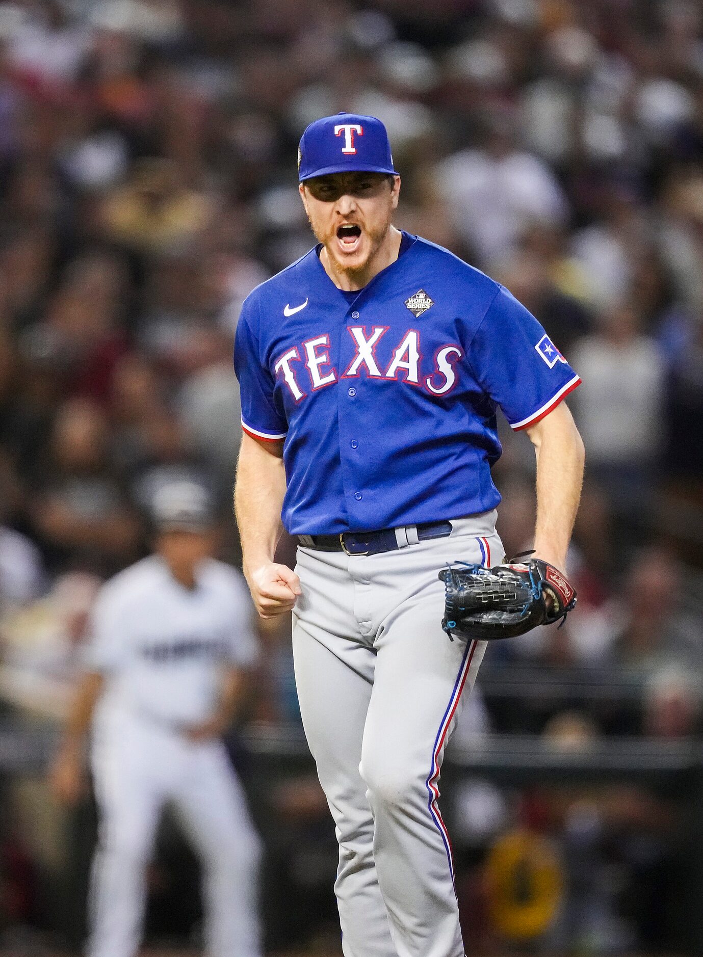 Texas Rangers relief pitcher Josh Sborz celebrates the final out of the eighth inning in...