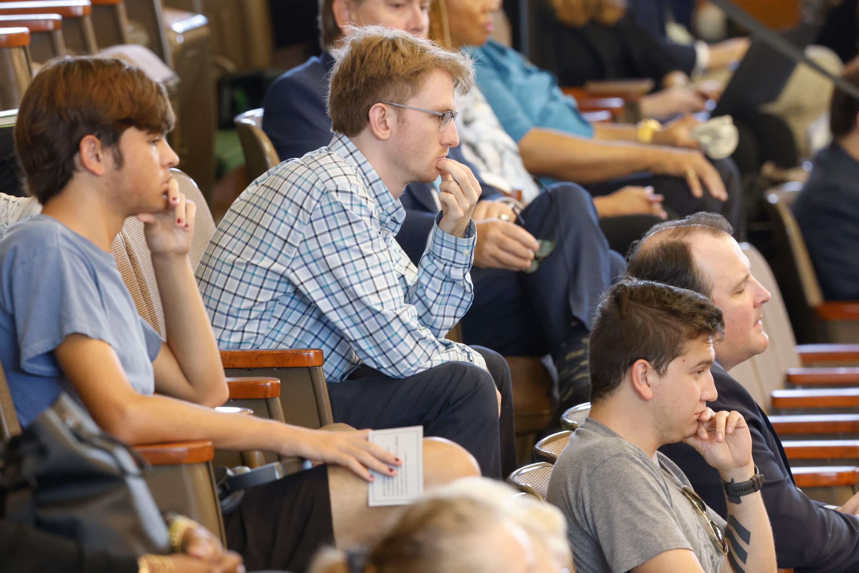 People listen witness testimony by Ryan Vassar, former deputy attorney general for legal...