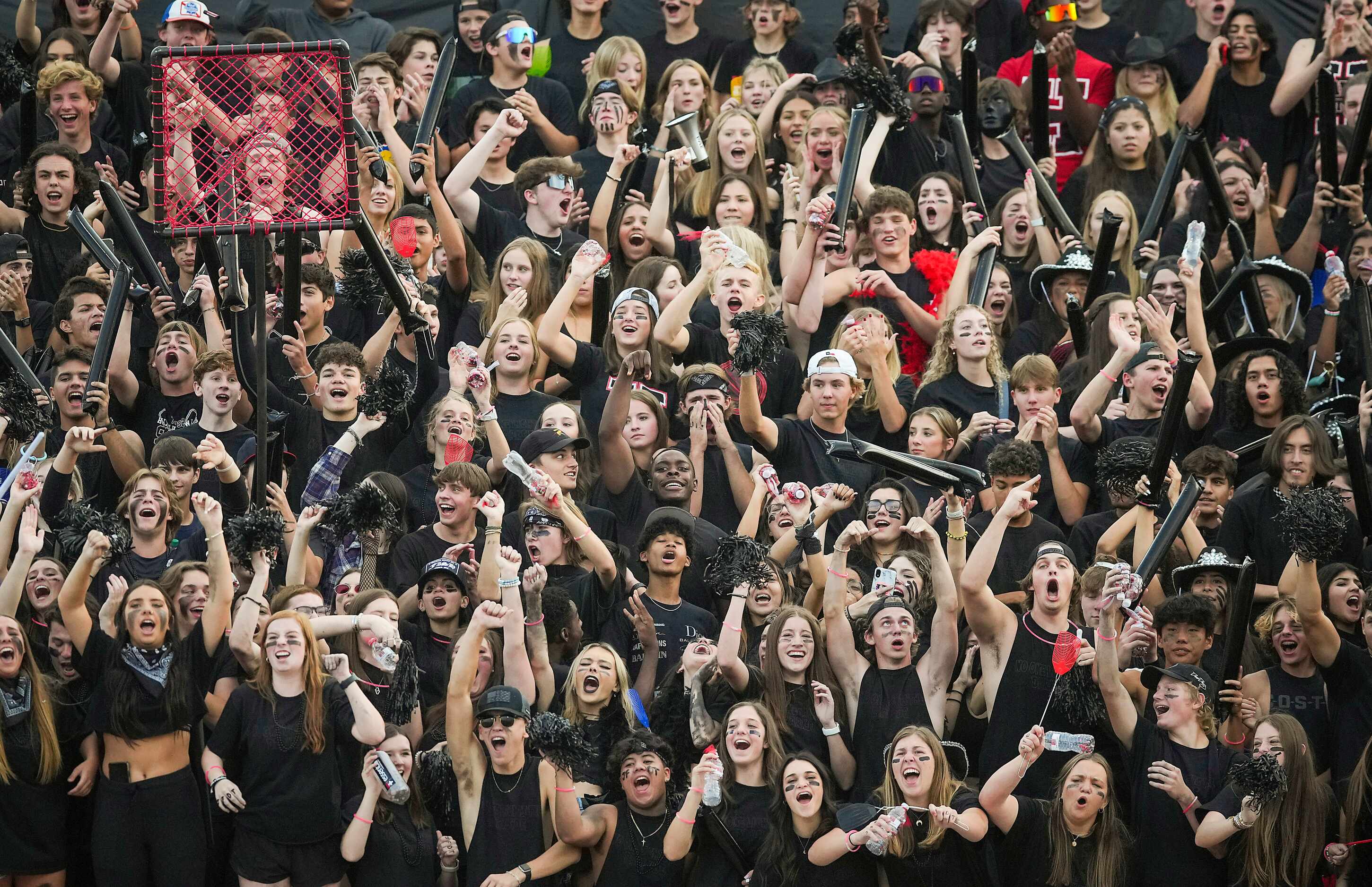 Rockwall-Heath fans cheer a Hawks touchdown during the first half of a District 10-6A high...