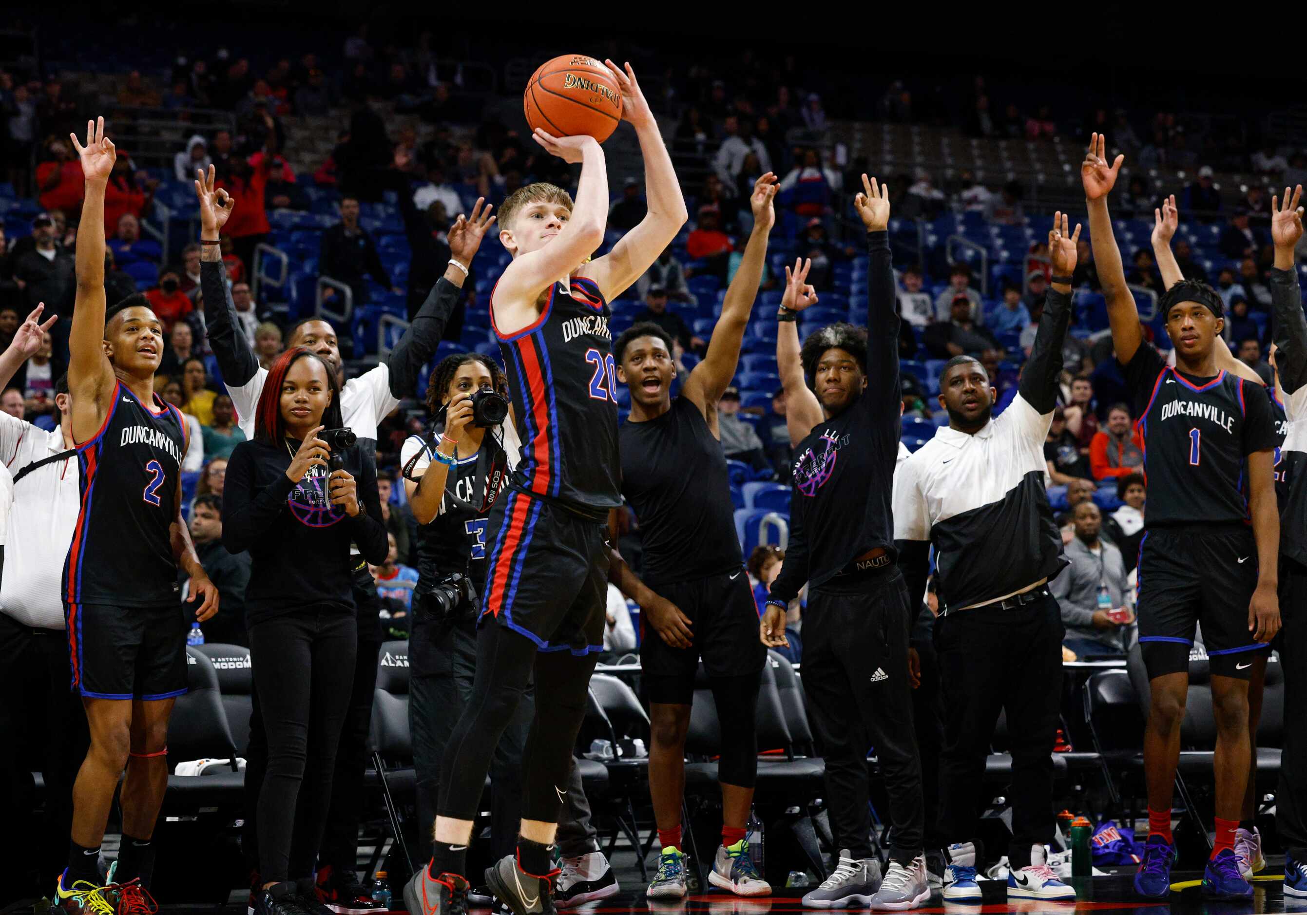 Duncanville guard Jackson Prince (20) shoots a three-point shot during the final seconds of...
