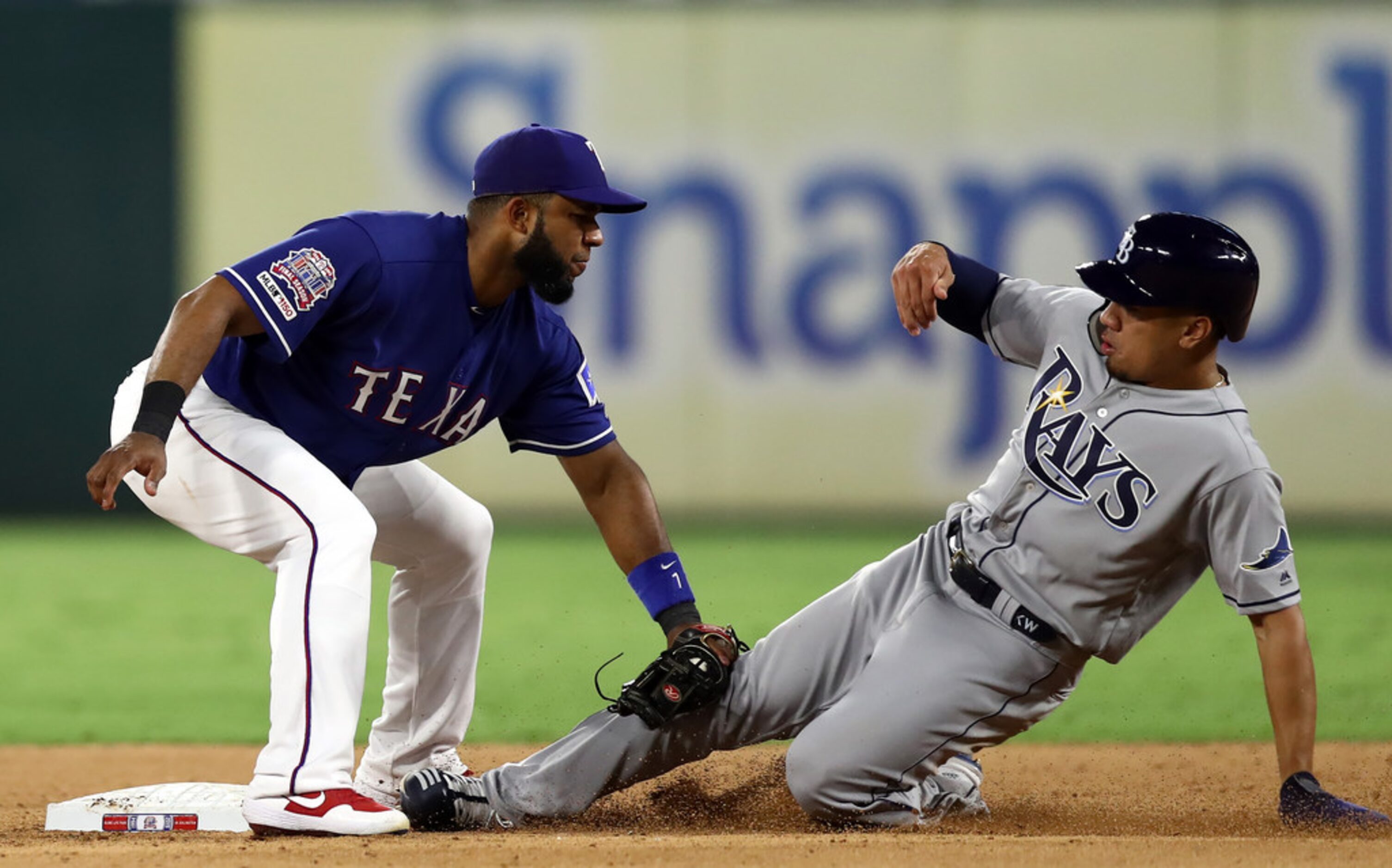 ARLINGTON, TEXAS - SEPTEMBER 10:  Elvis Andrus #1 of the Texas Rangers makes the out on the...