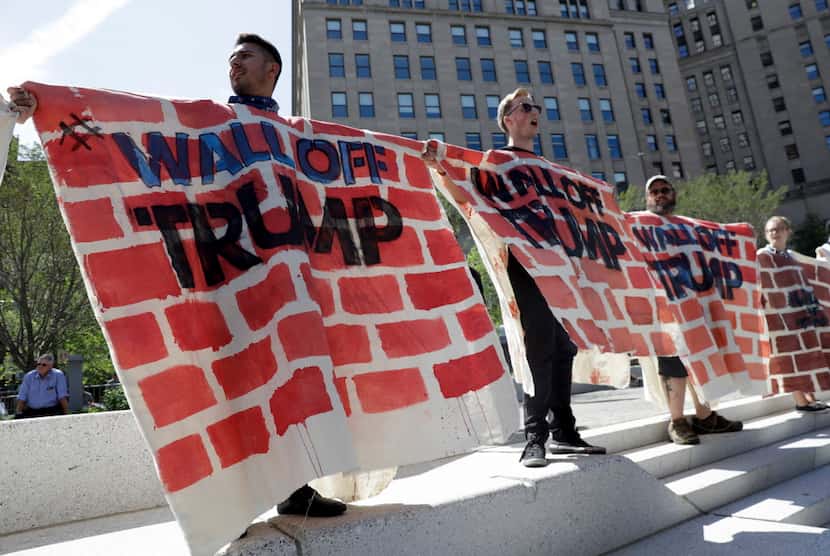 Immigrant rights activists demonstrated against Republican presidential nominee Donald Trump...