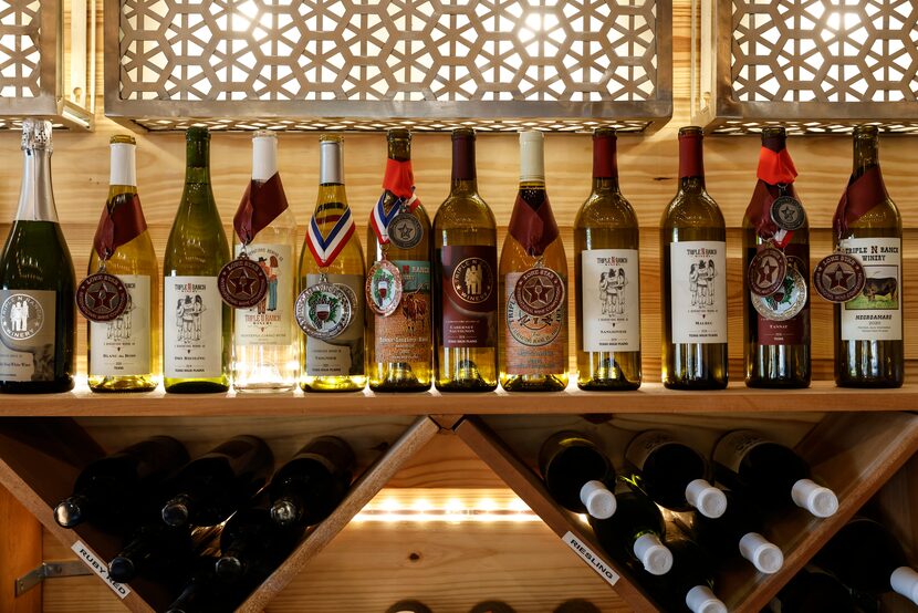 Awarded wines sit on a shelf at Triple N Ranch Winery.