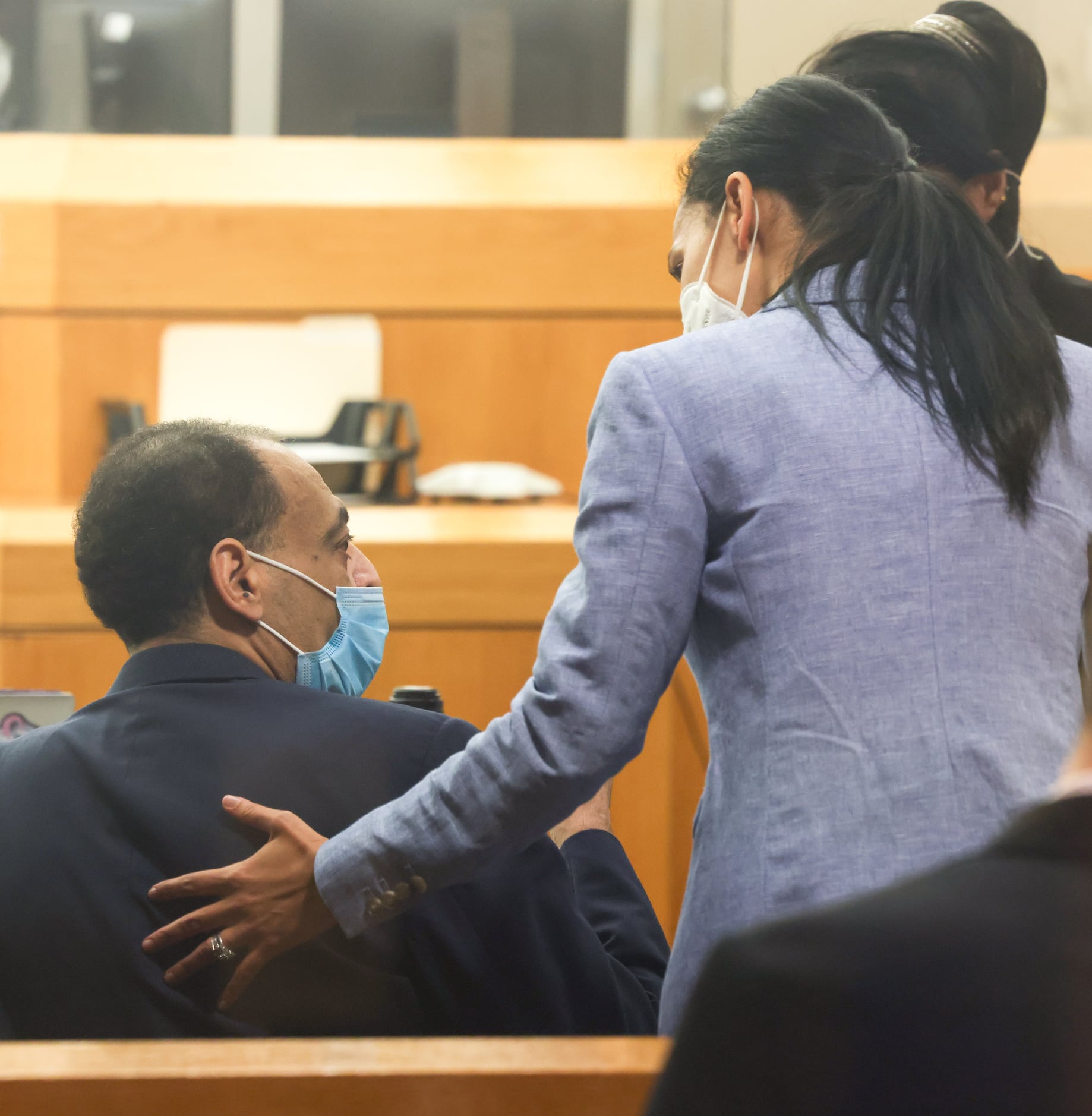 Yaser Said (left) speaks with defense attorney Baharan Muse after the jury retired to...