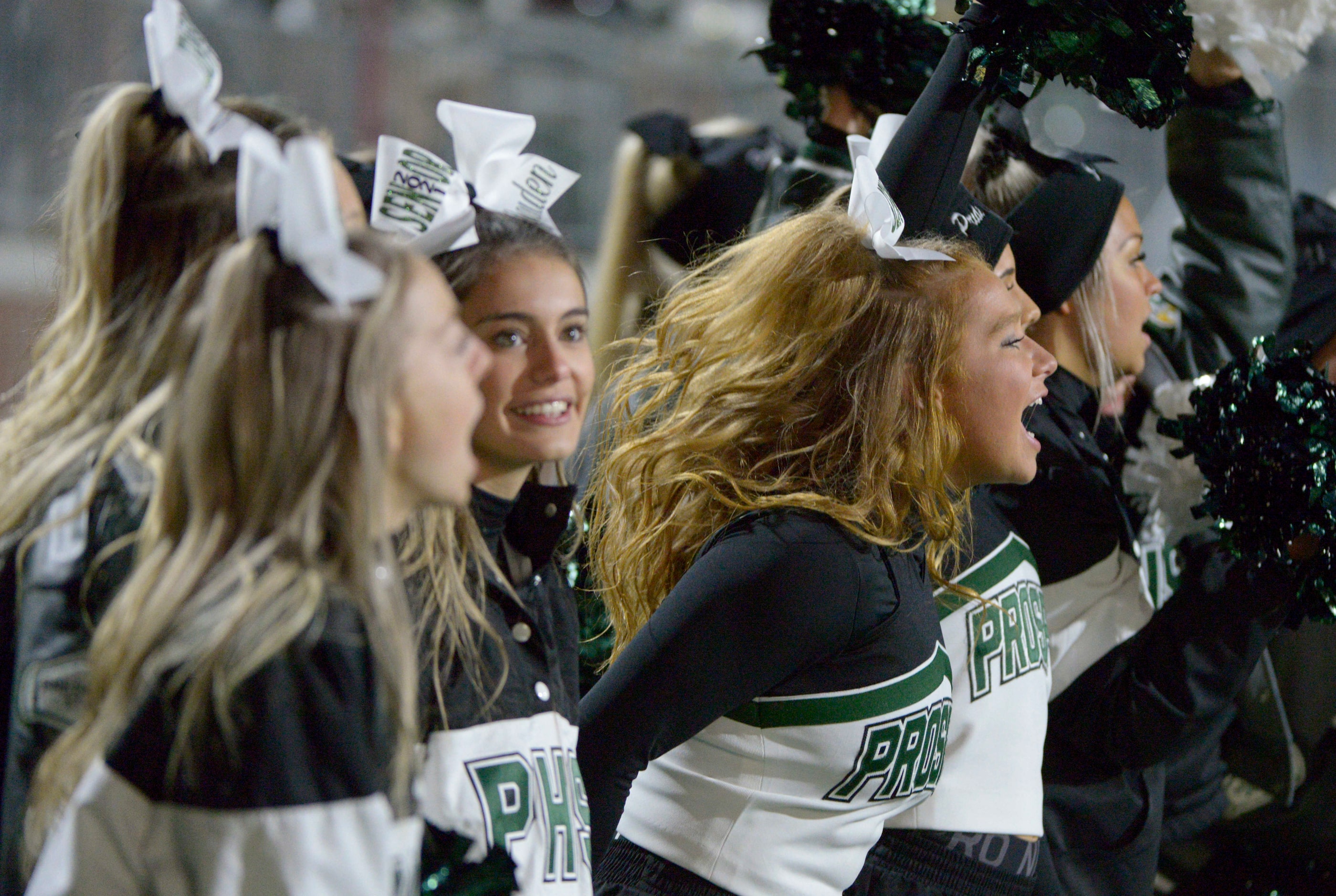 Prosper cheerleaders watch the final minutes of a high school football game between McKinney...