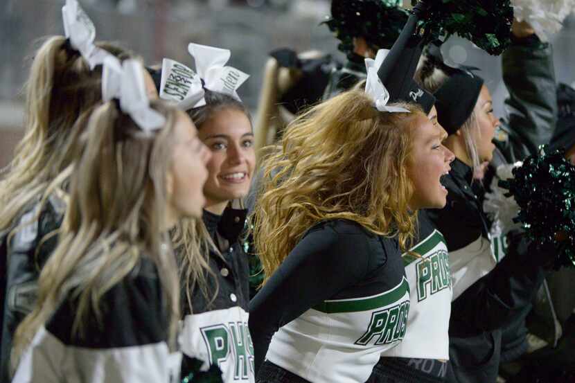 This file photo shows Prosper cheerleaders watching the final minutes of a high school...