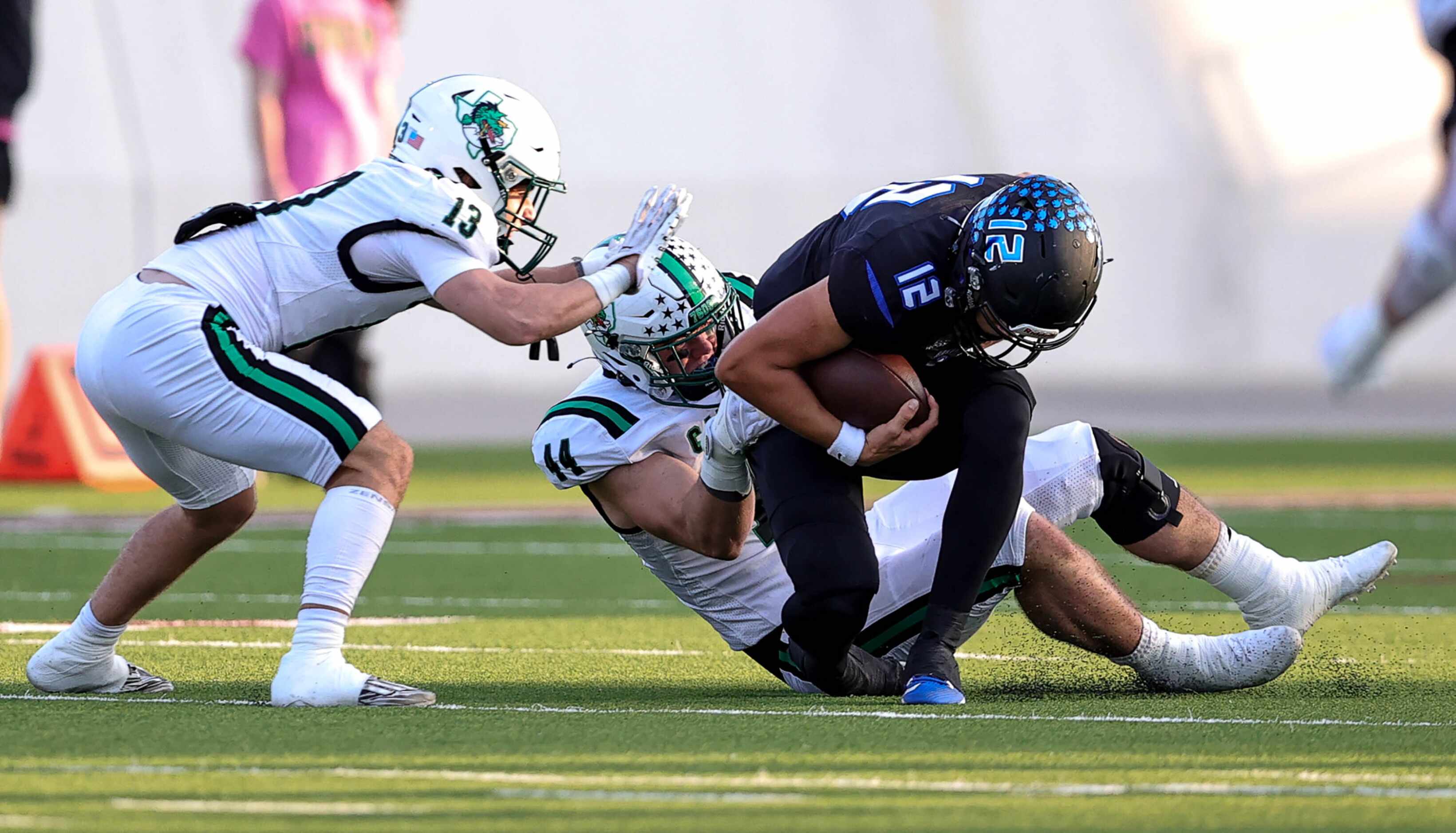 Byron Nelson quarterback Tom Von Grote (12) gets sacked by Southlake Carroll defensive...