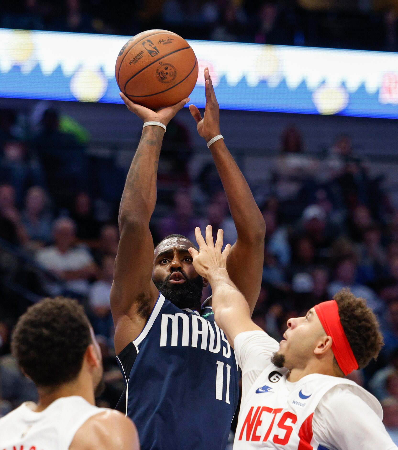 Dallas Mavericks forward Tim Hardaway Jr. (11) shoots over Brooklyn Nets guard Seth Curry...