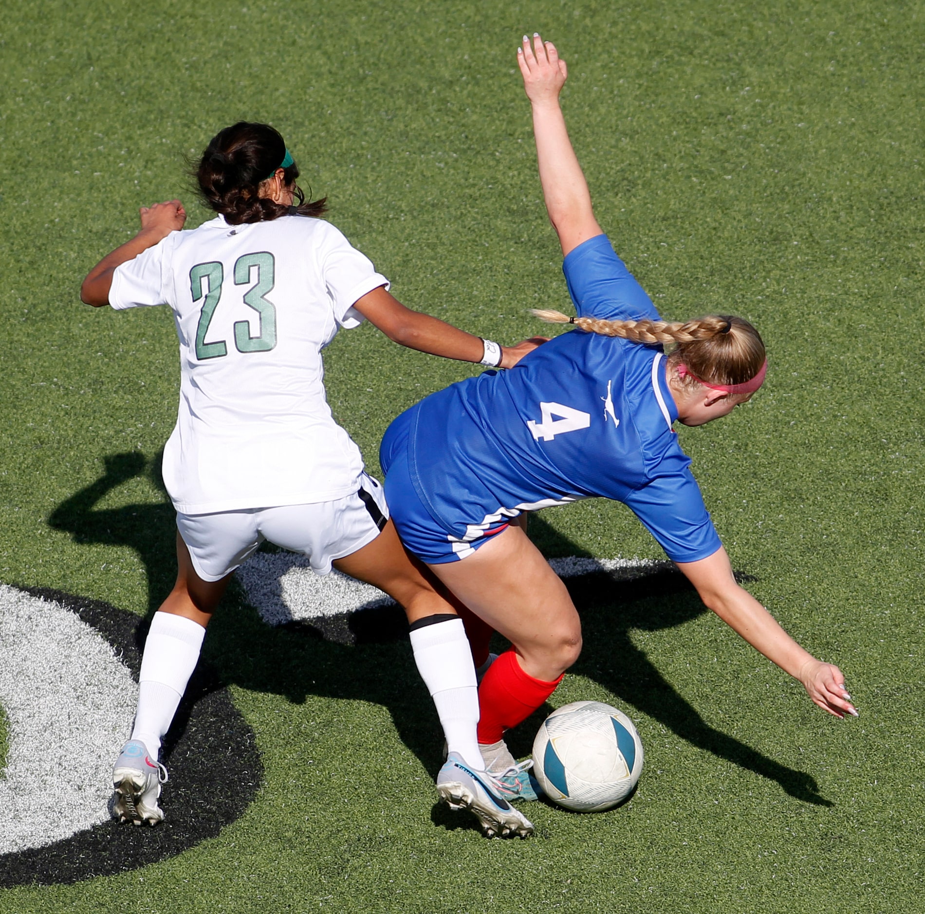 Prosper midfielder Samantha Tover (23), left, gets tangled with Austin Westlake midfielder...