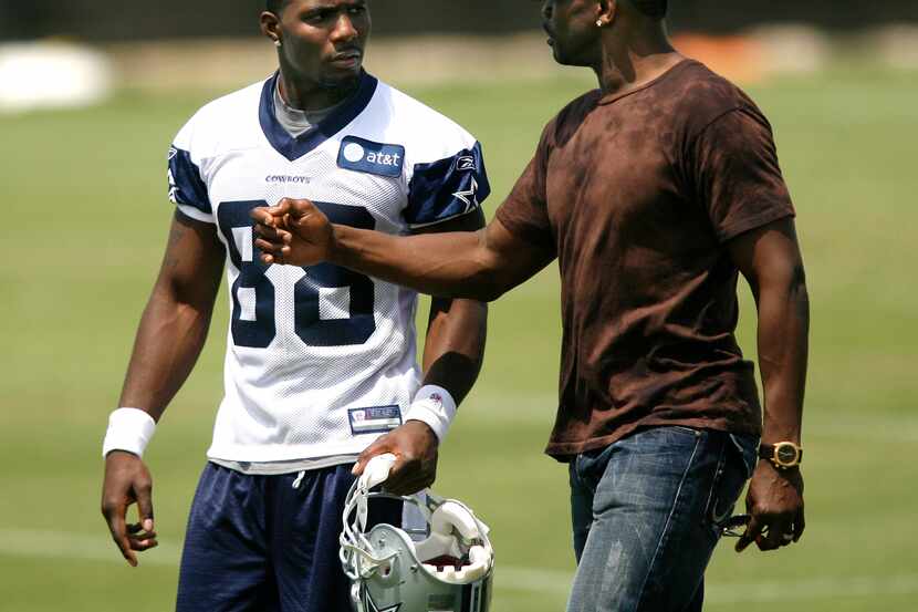 Wide receiver Dez Bryant (left) talks with former Cowboy wide receiver Michael Irvin at the...