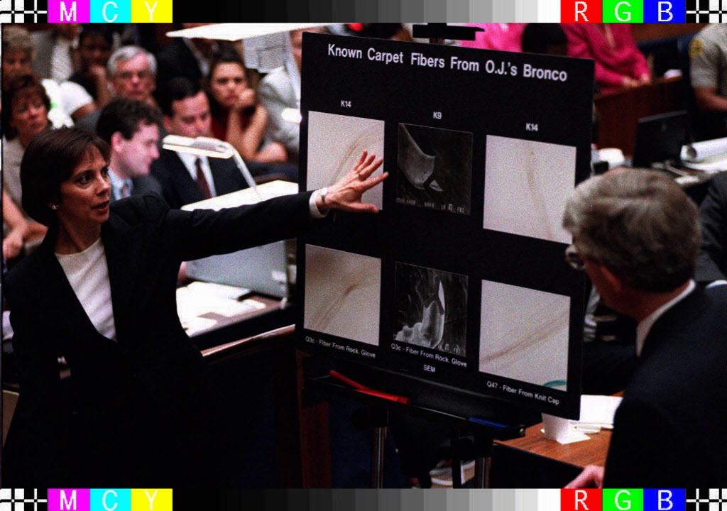 Lead prosecutor Marcia Clark, left, points to a magnified fiber from O.J. Simpson's Ford...