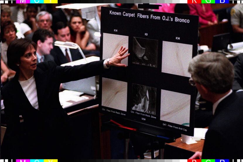Lead prosecutor Marcia Clark, left, points to a magnified fiber from O.J. Simpson's Ford...