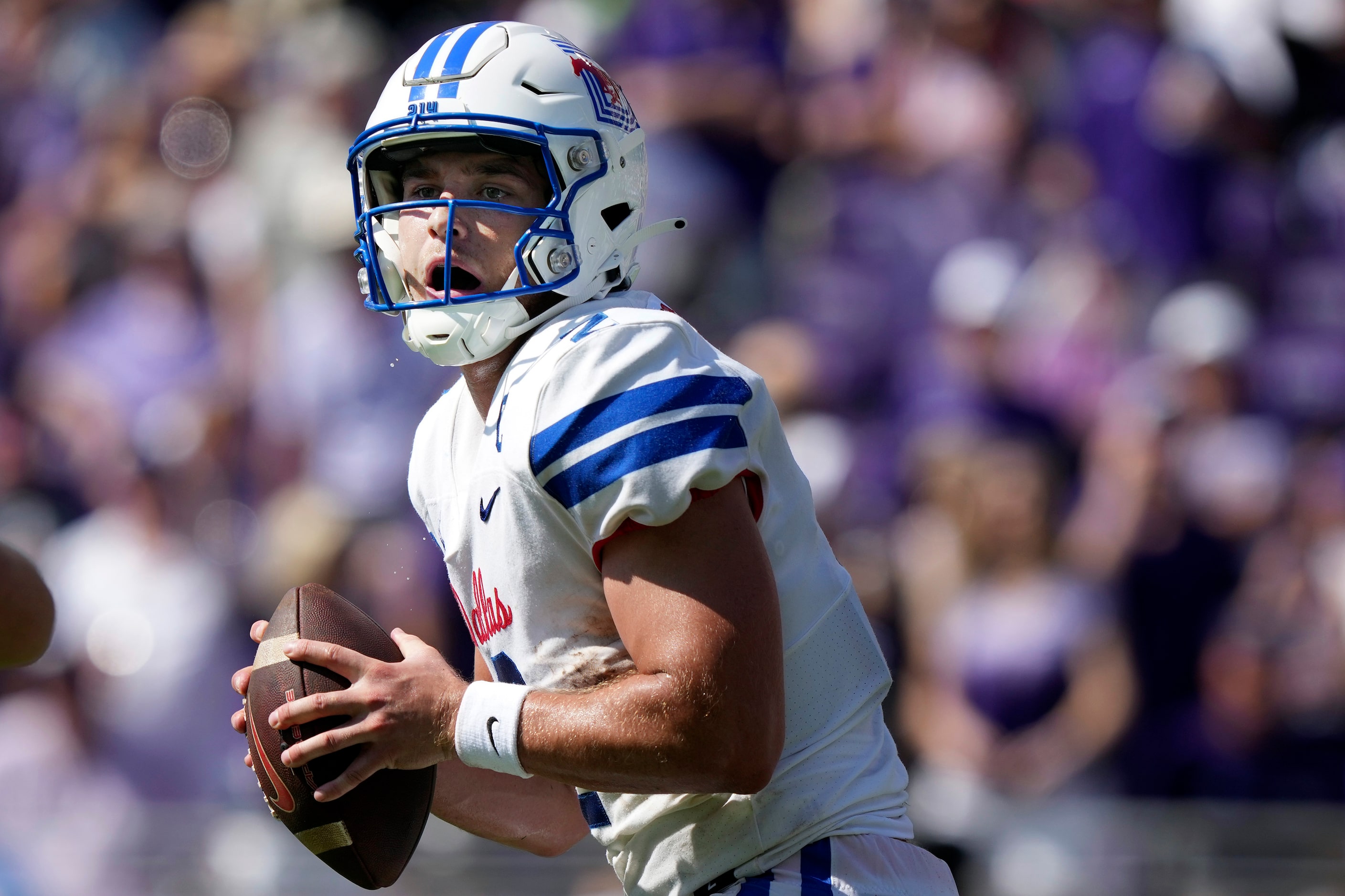 SMU quarterback Preston Stone (2) looks to pass during the first half of an NCAA college...