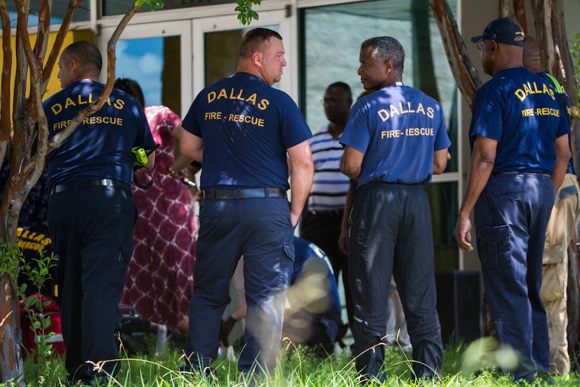 First responders treat a victim at the scene of an incident in the 2000 block of Postal Way...