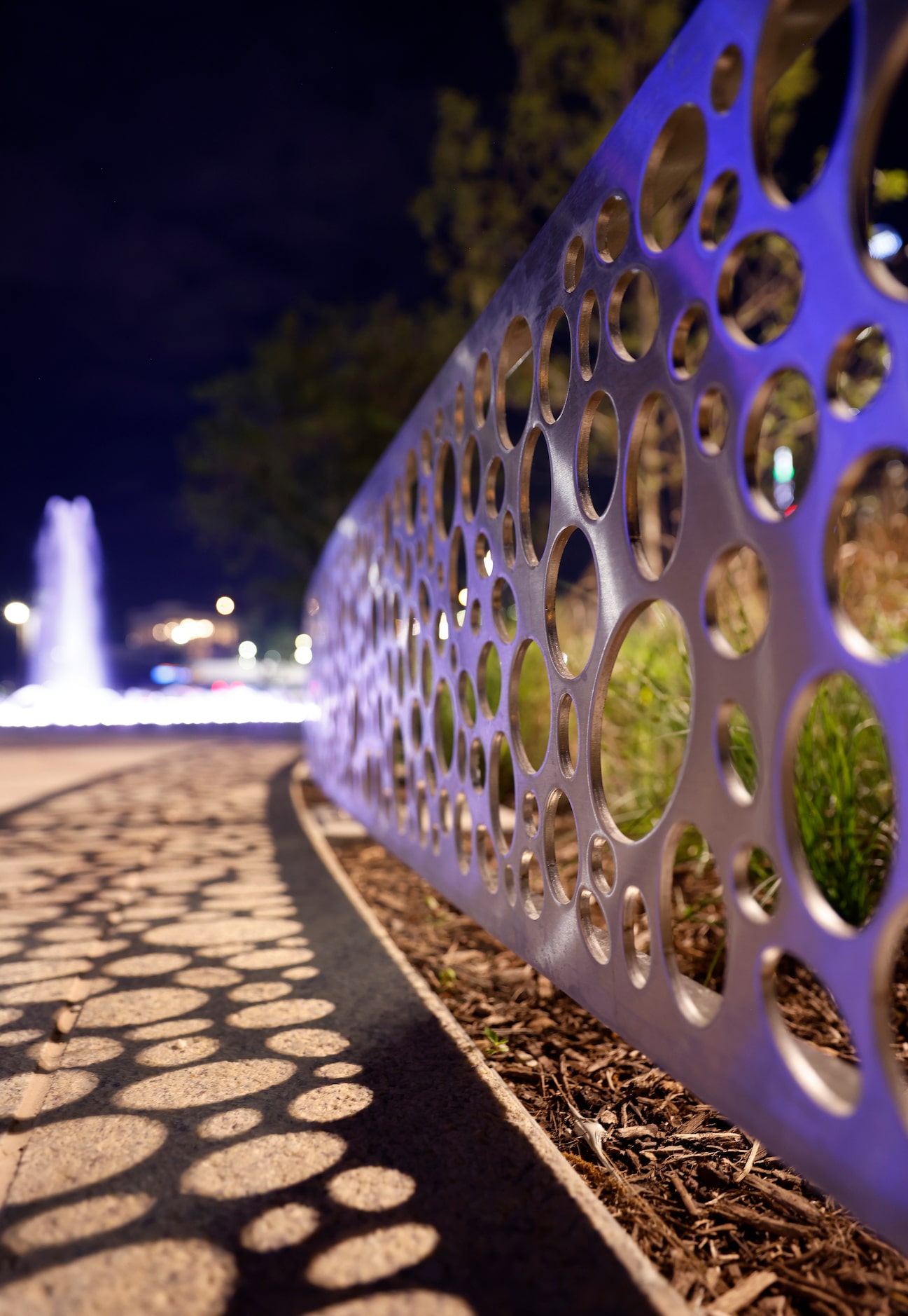 Low aluminum fencing contain the landscaping along one of the paths in the newly constructed...