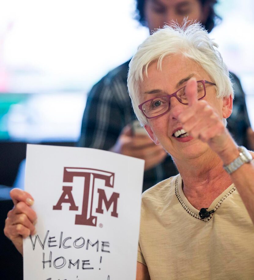 
DFW Airport ambassador Carolyn Jones holds a sign in support of Danielle Banks.
