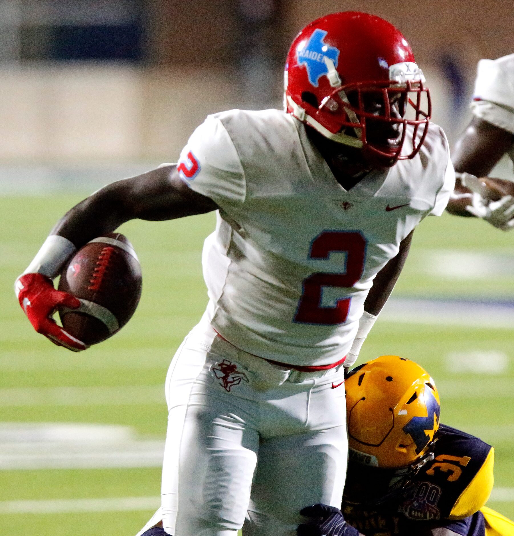 Skyline High School wide receiver Quaydaruis Davis (2) looks for room to run as McKinney...