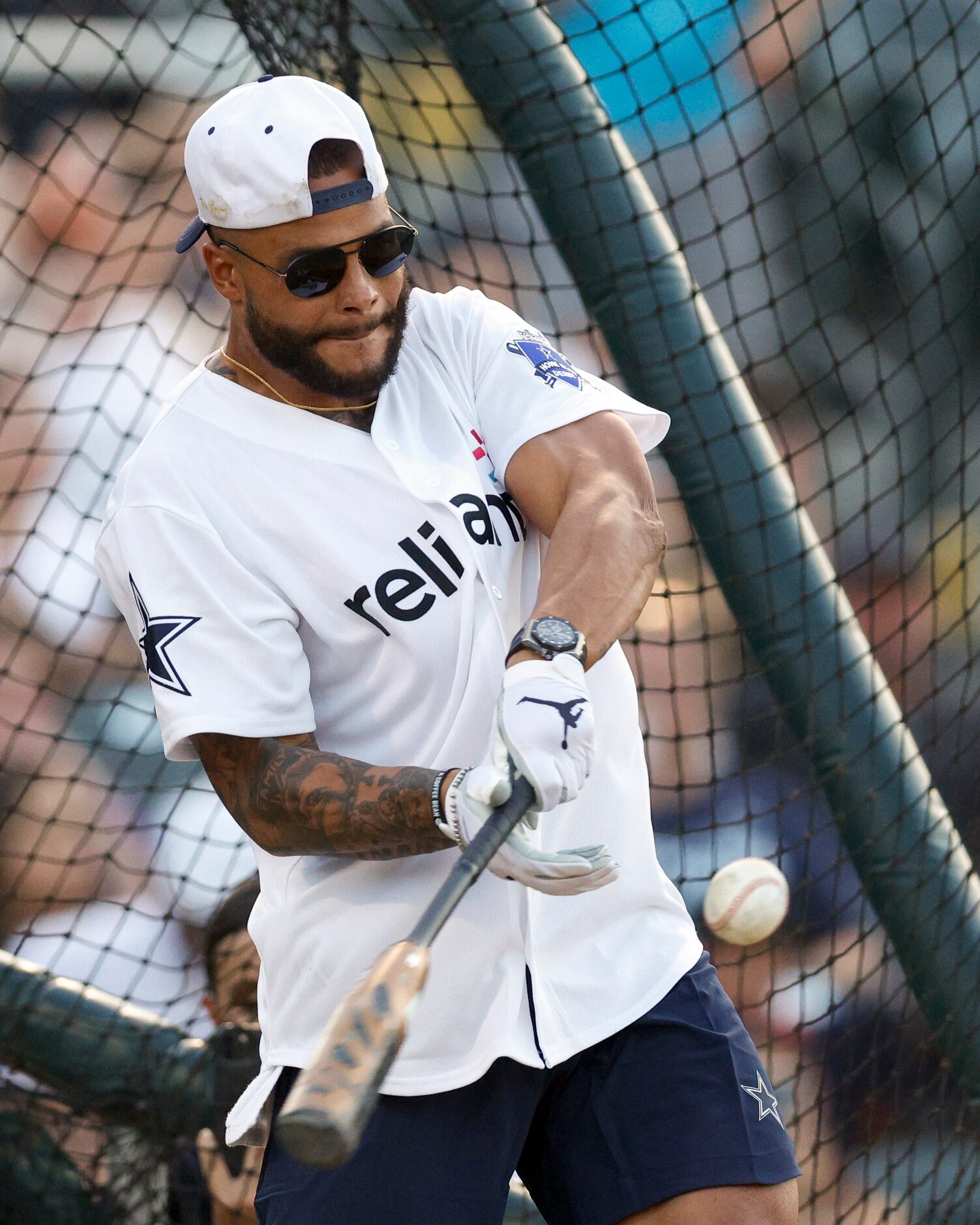 Dallas Cowboys quarterback Dak Prescott swings for the ball during the Reliant Energy Home...