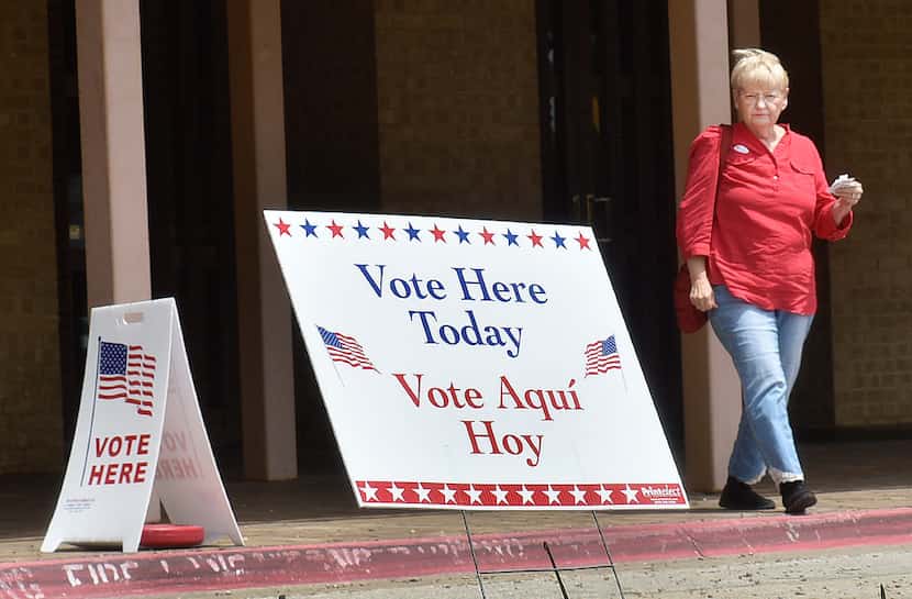 Peggy Capps walks out of the Denton Civic Center after casting her ballot Monday on the...