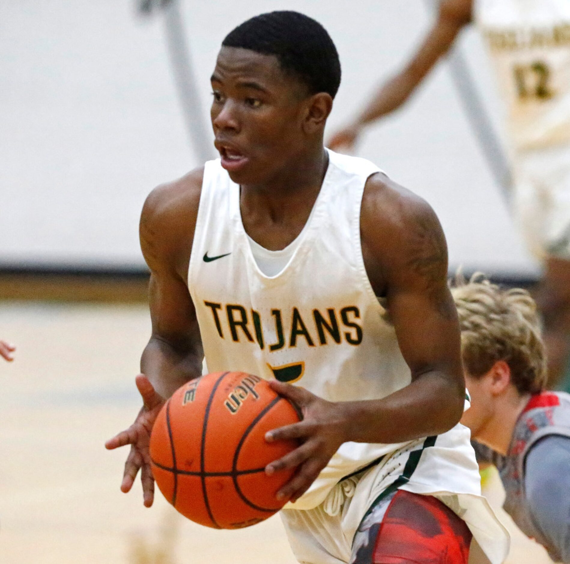 Newman Smith High School guard Devin Peters-Teague (5) grabs a loose ball during the first...