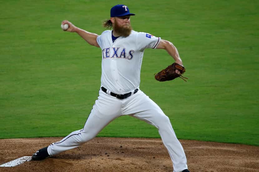Texas Rangers starting pitcher Andrew Cashner (54) throws a pitch against Boston Red Sox...
