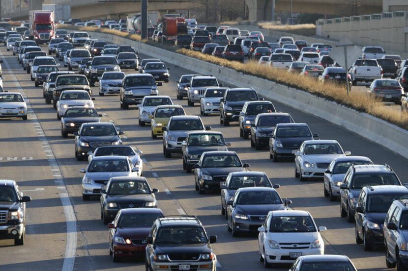 In this Friday, Feb. 1, 2013 photo, traffic stacks up on a highway in Dallas.(AP Photo/LM...