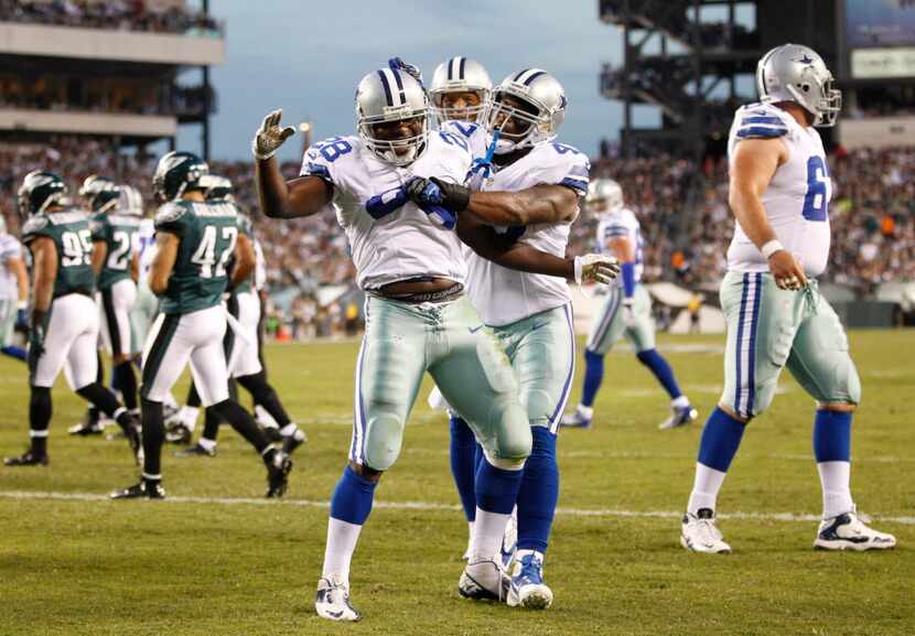 Dallas Cowboys running back Felix Jones (28) celebrates a touchdown with teammates Dallas...